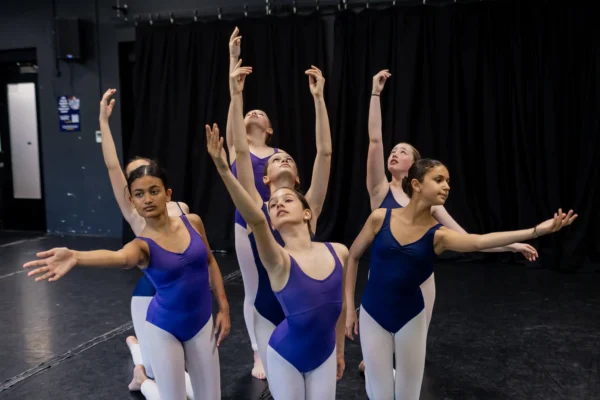 ballerinas-posing-in-dance-studio