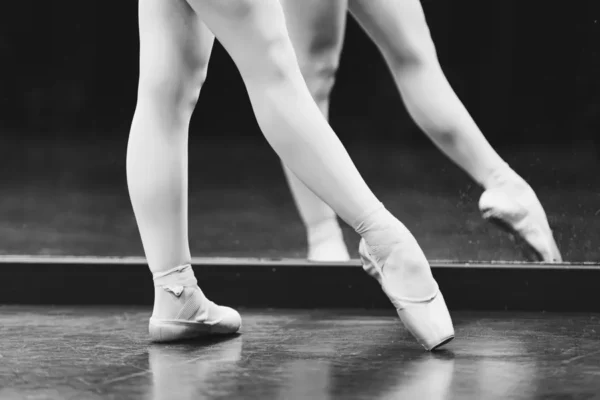 Close-up of Teen and Senior dancers practising pointe work
