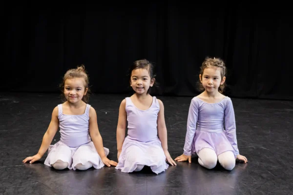 three-young-ballerinas-sitting
